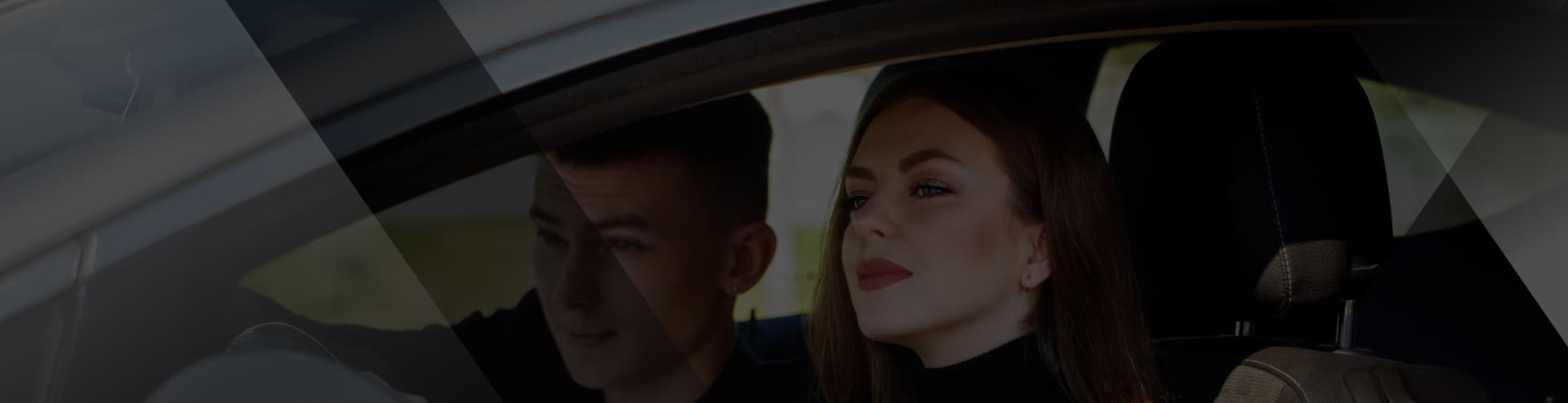 Learner and driving instructor sitting in a tuition car